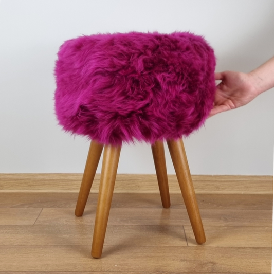 Pink genuine sheepskin stool with oak legs